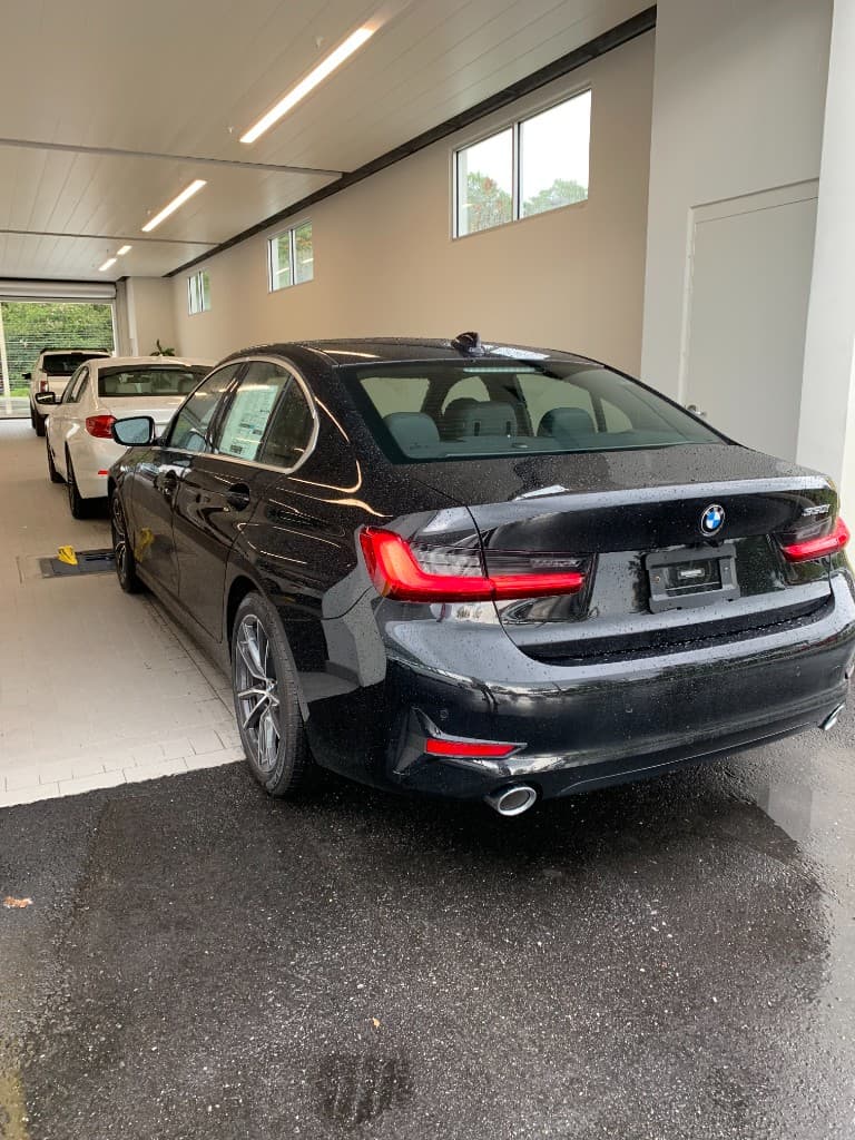 Black BMW 330i ready for pickup at the dealership